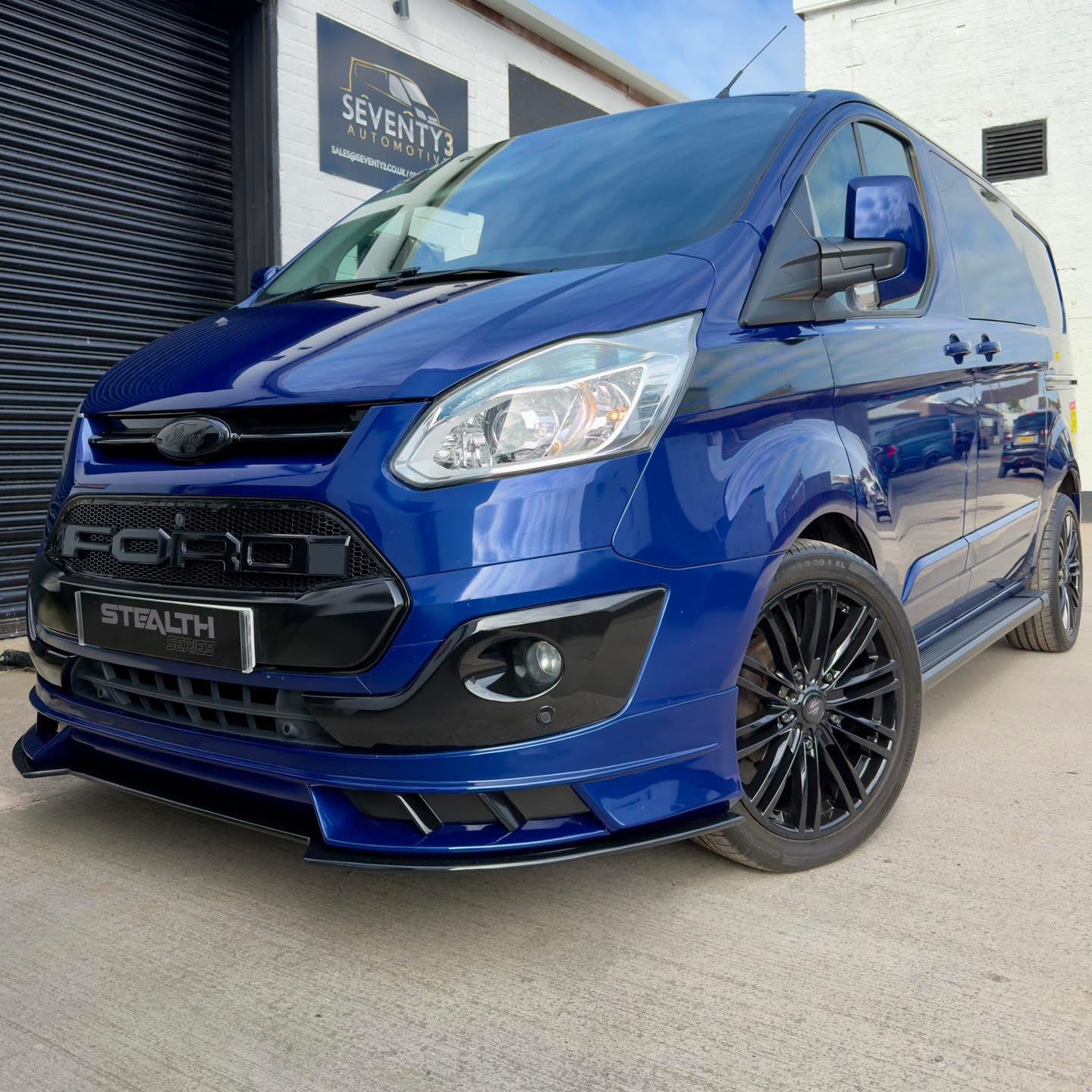 Deep Impact Blue Ford Transit Custom STEALTH Series front three-quarter view